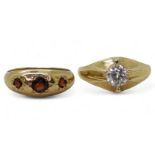A 9ct gold gypsy ring set with a clear gem size T1/2, a 9ct gold dome ring star set with three