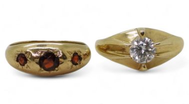 A 9ct gold gypsy ring set with a clear gem size T1/2, a 9ct gold dome ring star set with three