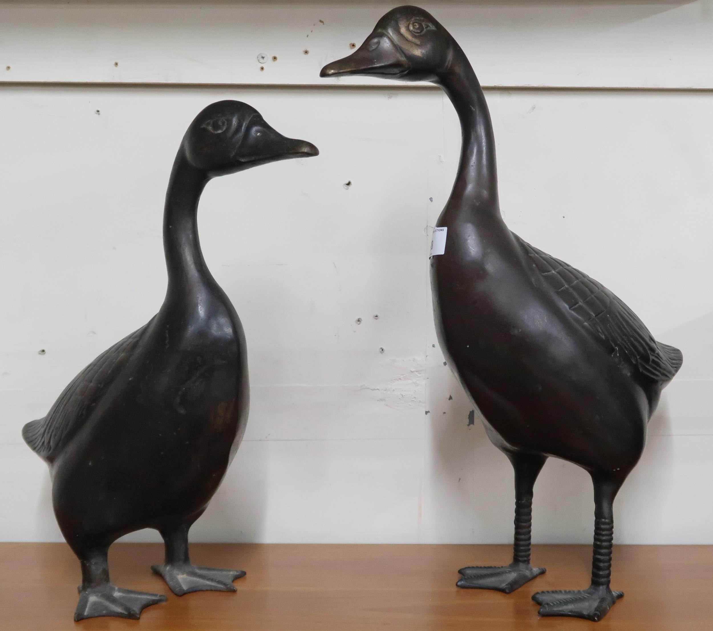 A lot of two cast metal garden ornaments in the form of ducks tallest 47cm high (2) Condition