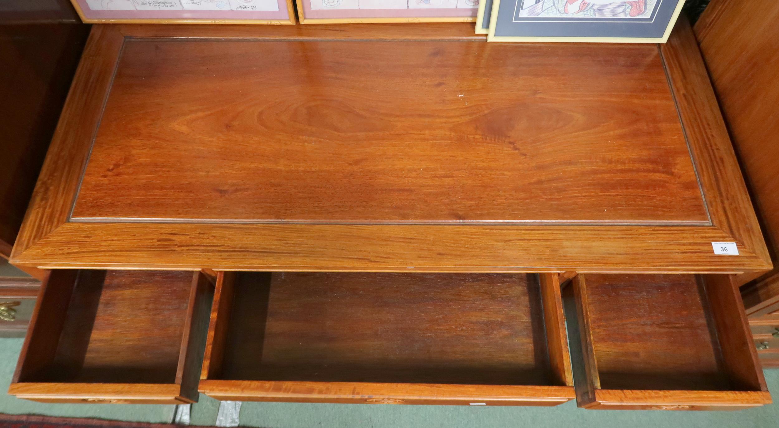 A contemporary Oriental hardwood writing desk with long central drawer flanked by two short - Image 2 of 3