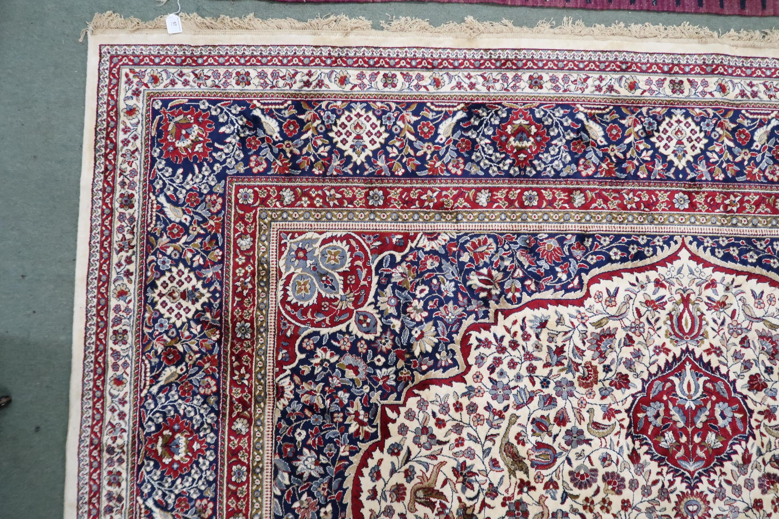 An Ivory ground full pile Cashmere rug with red central medallion, dark blue spandrels on floral - Image 3 of 4