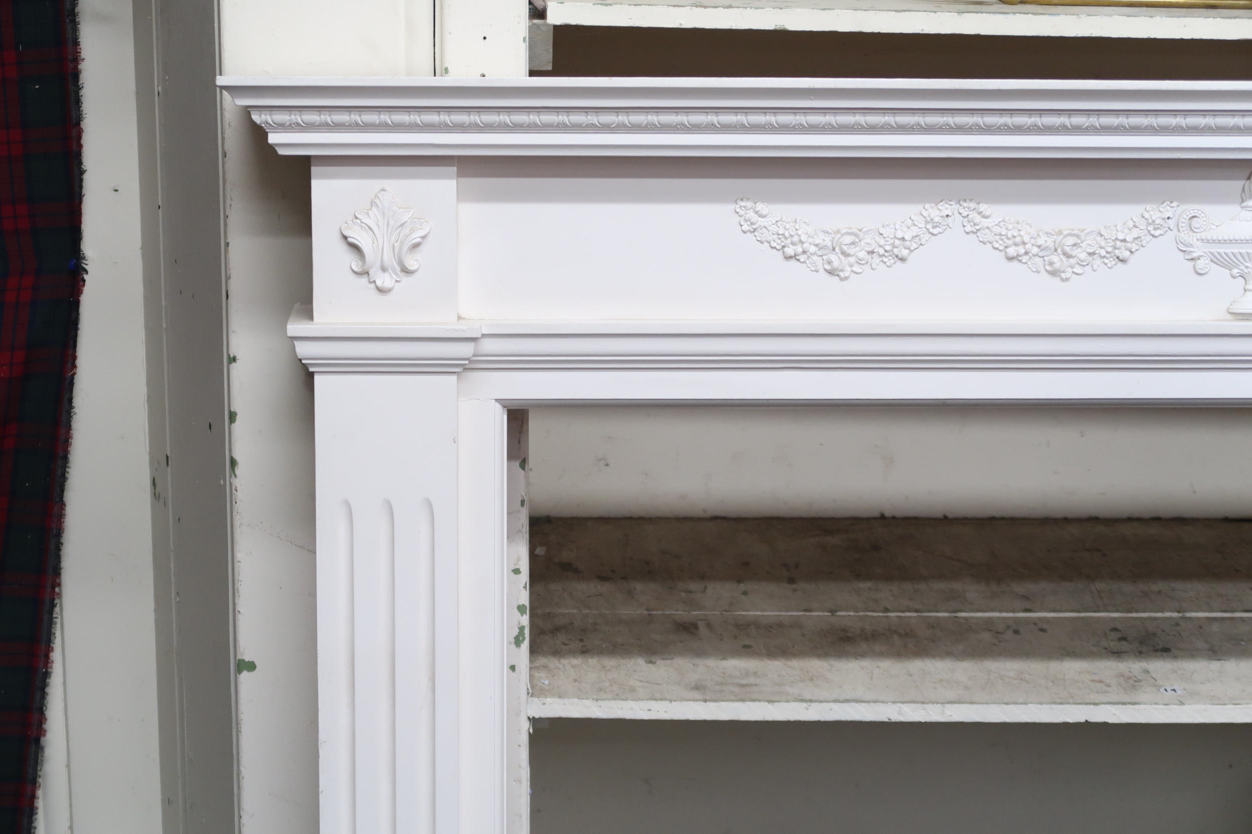 A 20th century white painted Rococo style fire surround, 118cm high x 163cm wide x 19cm deep, a - Image 2 of 3