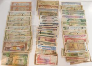 A lot comprising South East Asian bank notes with examples from Cambodia, Laos, Vietnam and Burma (