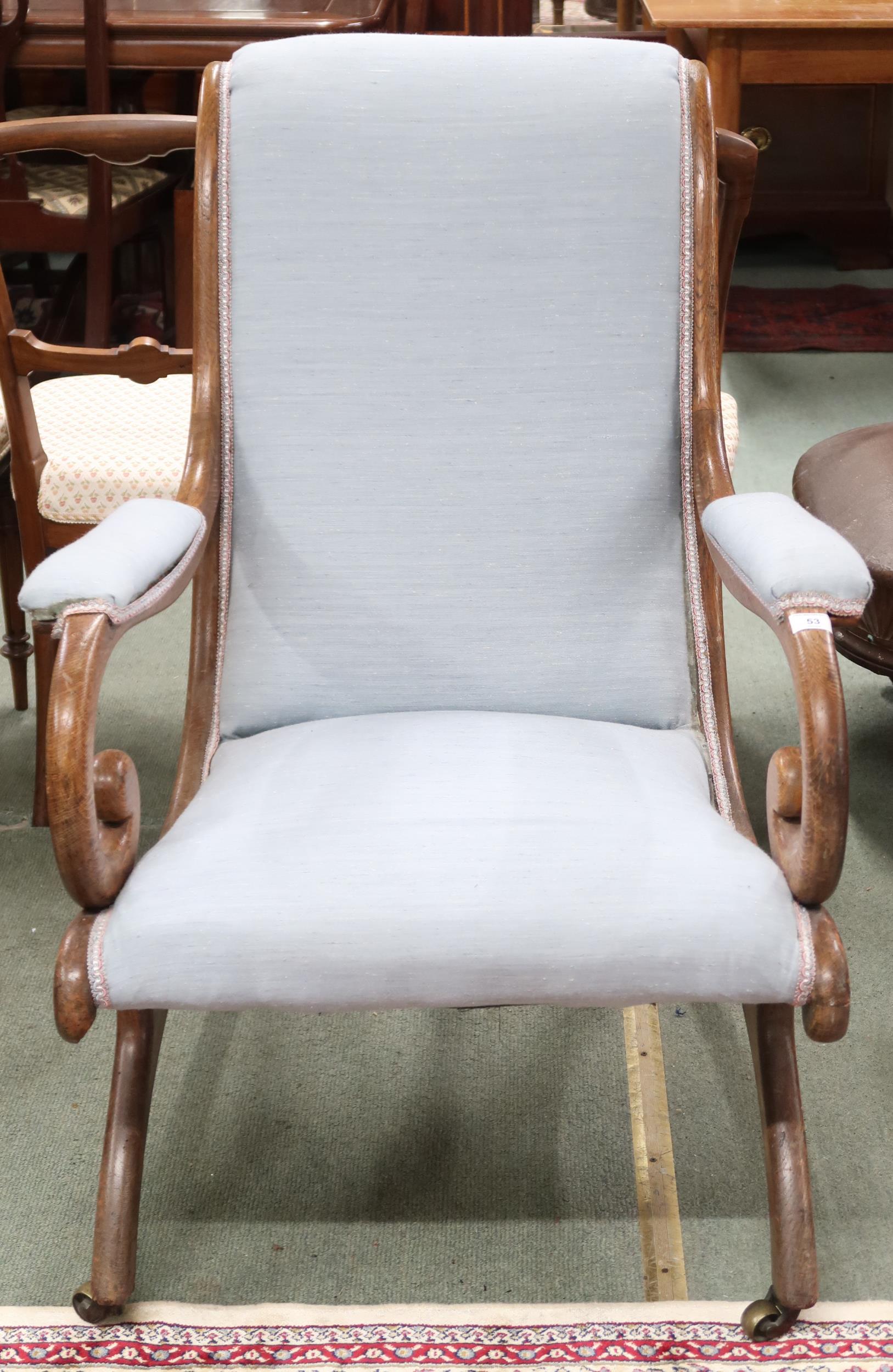 A Victorian oak framed scroll armed slipper chair on bowed supports, 95cm high x 69cm wide x 88cm