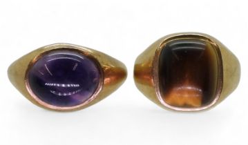 Two 9ct gold gem set signet rings, amethyst size U, and a tiger's eye ring, size Q weight together