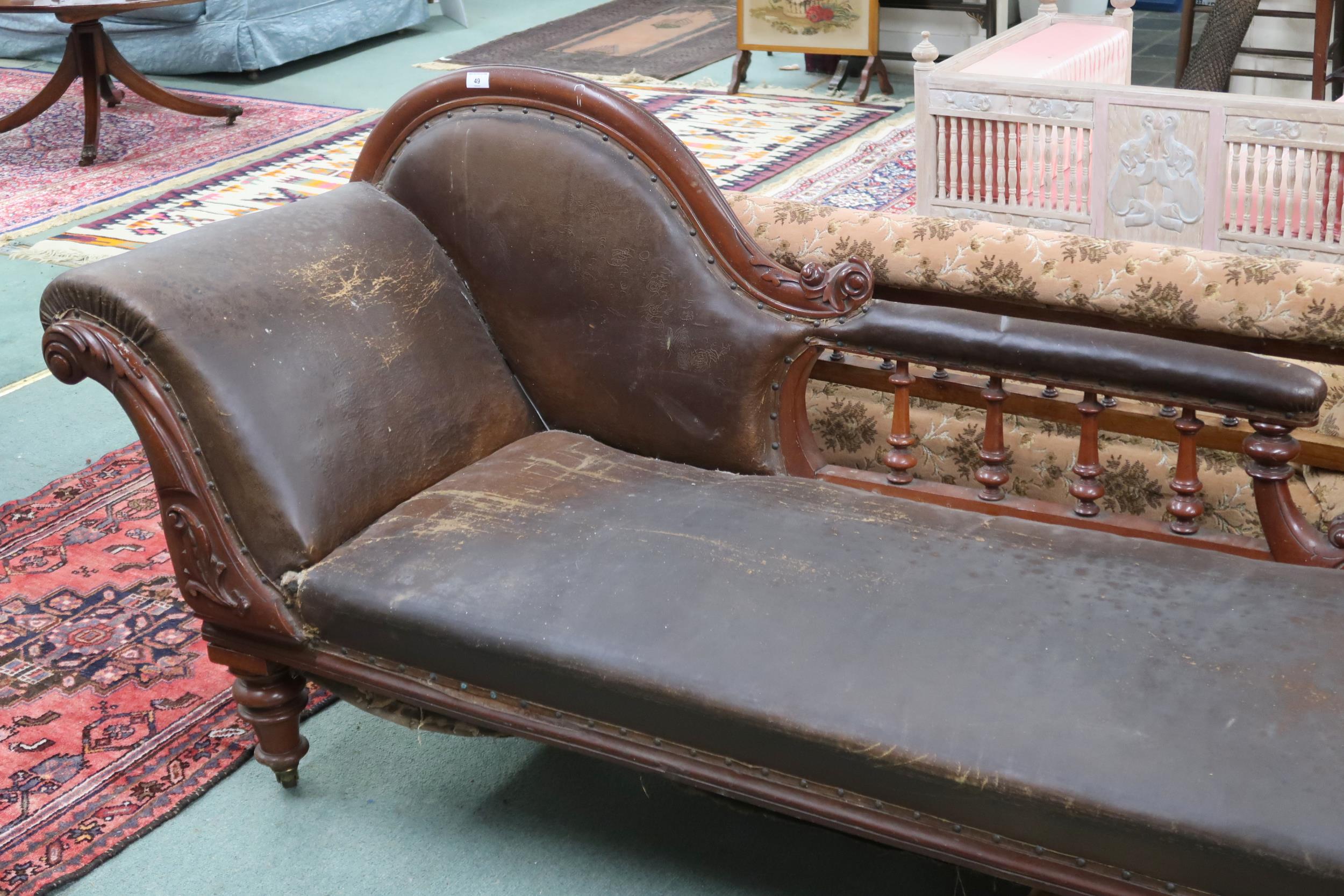 A late Victorian continental walnut framed chaise longue with humped spinel back and scrolled end on - Image 2 of 2