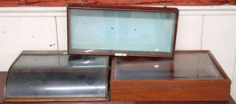 A lot comprising two assorted countertop bijouterie cabinets and a glazed wall display (3) Condition