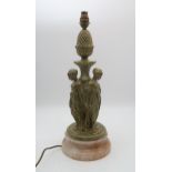 A table lamp modelled as the three graces, upon onyx base Condition Report:Available upon request