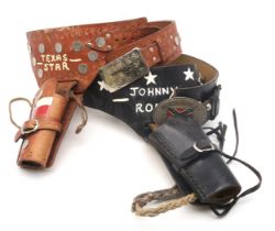 Two American Western gun belts or buscaderos, one painted with "Texas Star" detail, the other