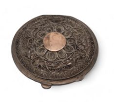 An Egyptian white metal niello filigree powder compact, with decoration of boats to the lid and palm