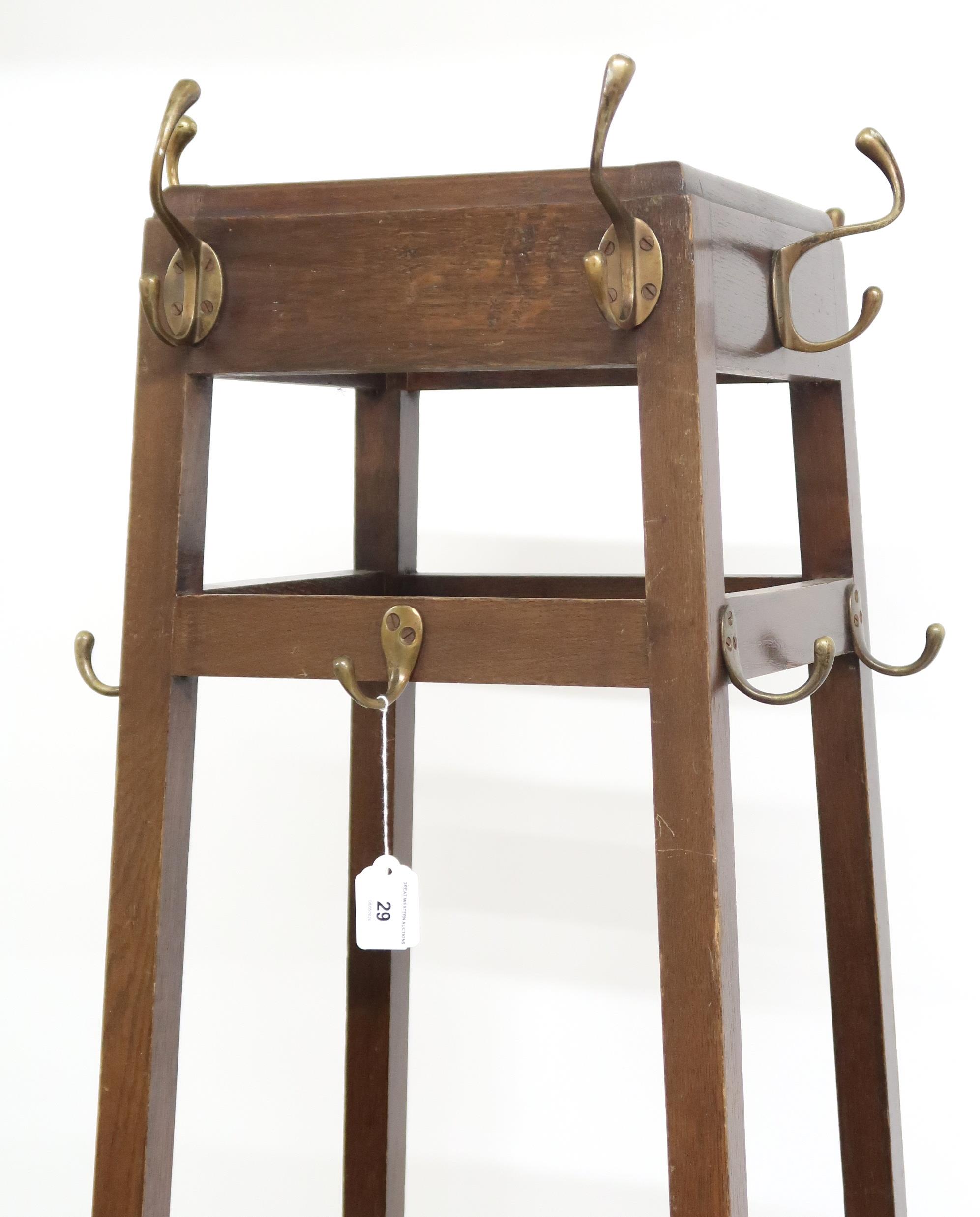 A 20th century oak freestanding hat and coat stand with coat hooks over open umbrella/stick - Image 2 of 2