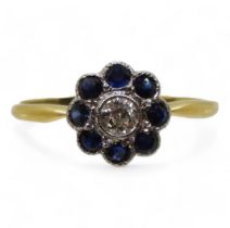 An 18ct gold sapphire and diamond flower ring, set with an estimated approx 0.12ct old cut