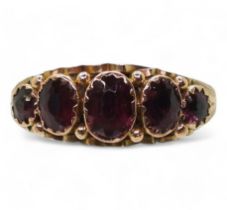 A 9ct gold five garnet set ring, with Chester hallmarks for 1911, size Q, weight 1.9gms Condition