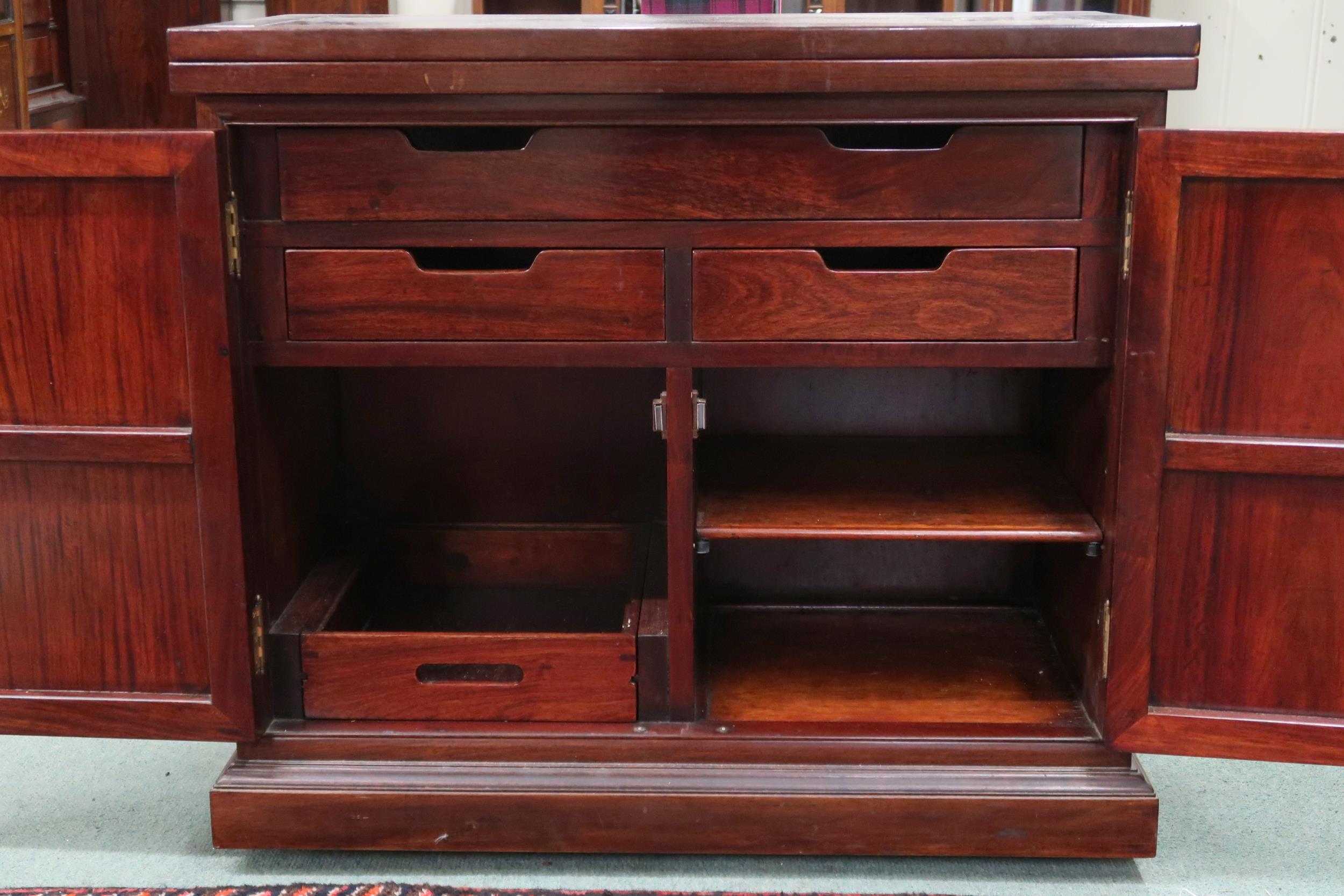 A 20th century Oriental hardwood bar/drinks cabinet with folding counter top over pair of cabinet - Image 2 of 3