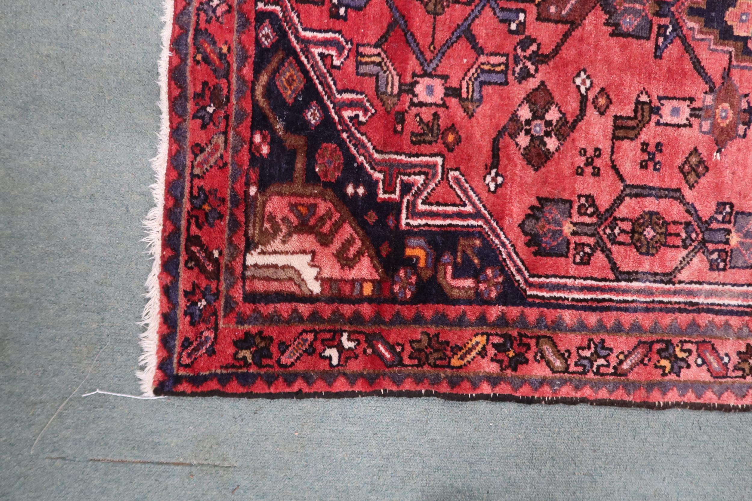A red ground Hamadan runner with dark central medallion, matching spandrels on floral pattern - Image 3 of 4