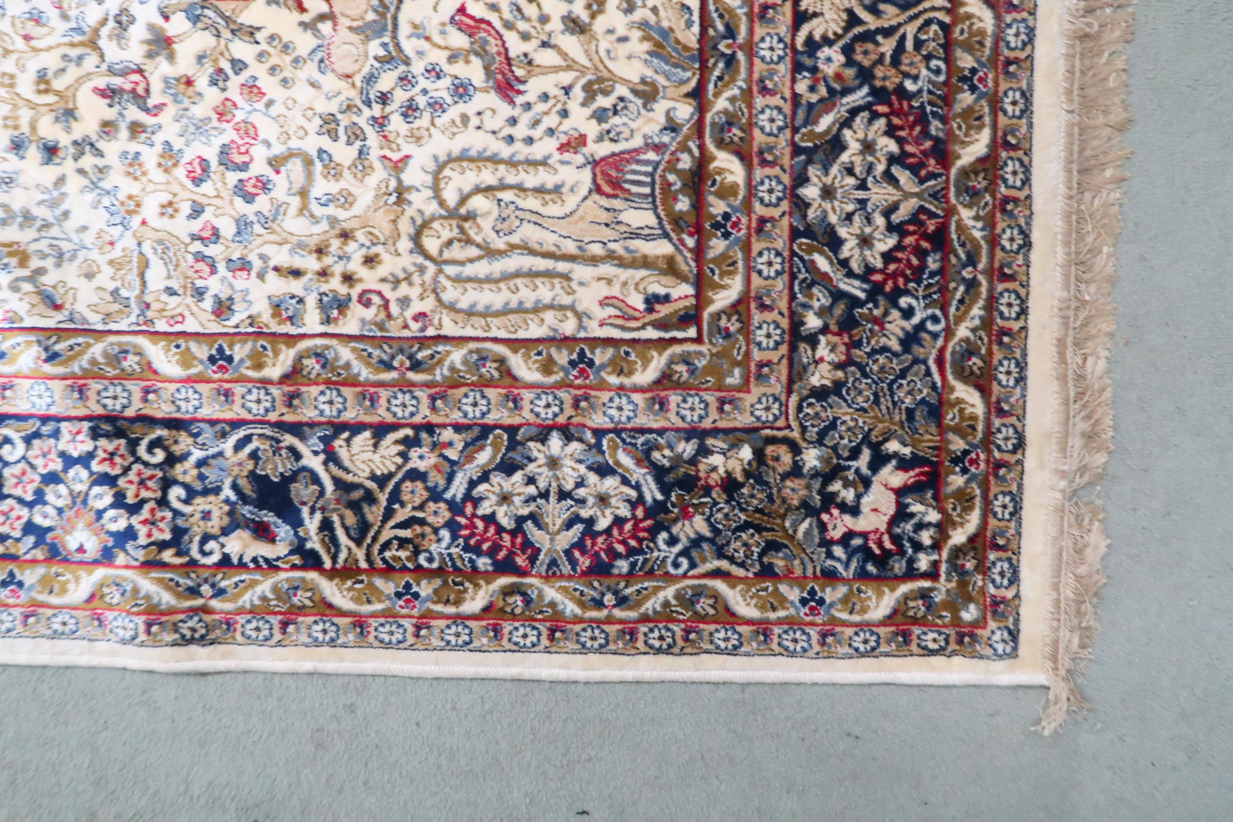 A cream ground full pile Kashmir rug with unique tree of life design with stylized animals within - Image 2 of 3