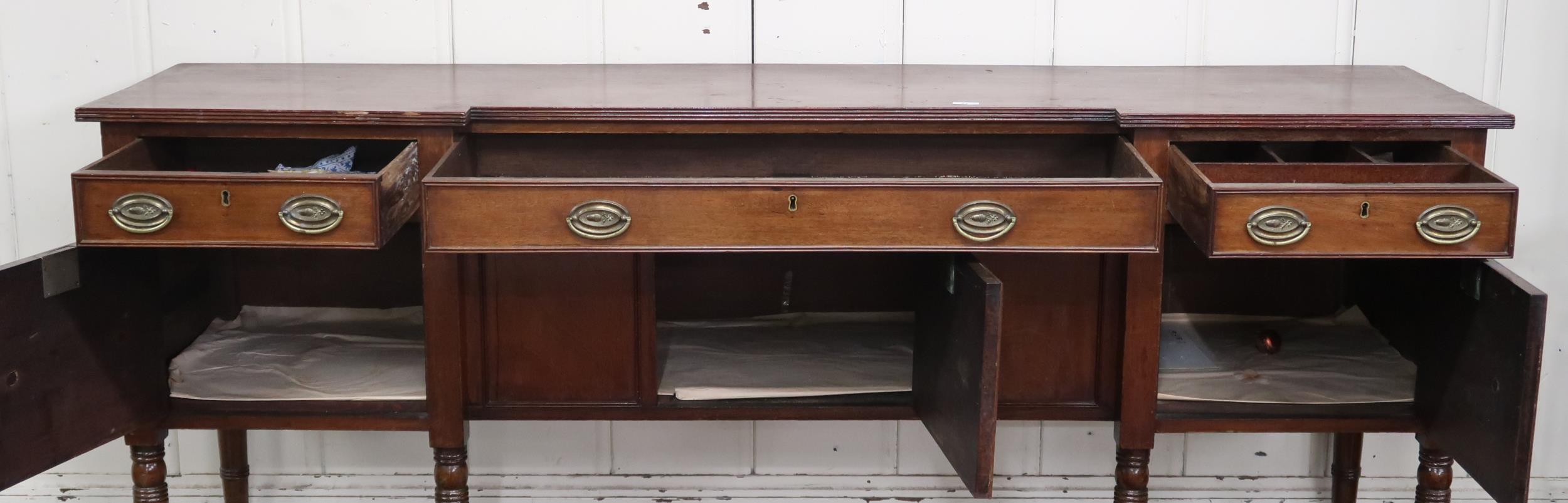 A late Victorian mahogany inverted breakfront sideboard with three drawers over three cabinet - Image 3 of 3