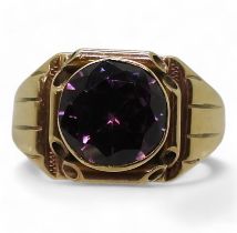 A 9ct gold ring set with a faux amethyst hallmarked Birmingham 1962, size S1/2, weight 9.4gms