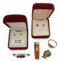 A collection of gold and yellow metal items to include a garnet set brooch,  two pairs of gem set