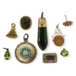 A collection of gold and yellow metal items to include, a turquoise set locket, a New Zealand jade