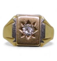 An 18ct yellow and white gold signet ring set with a clear gem, full Birmingham import marks for