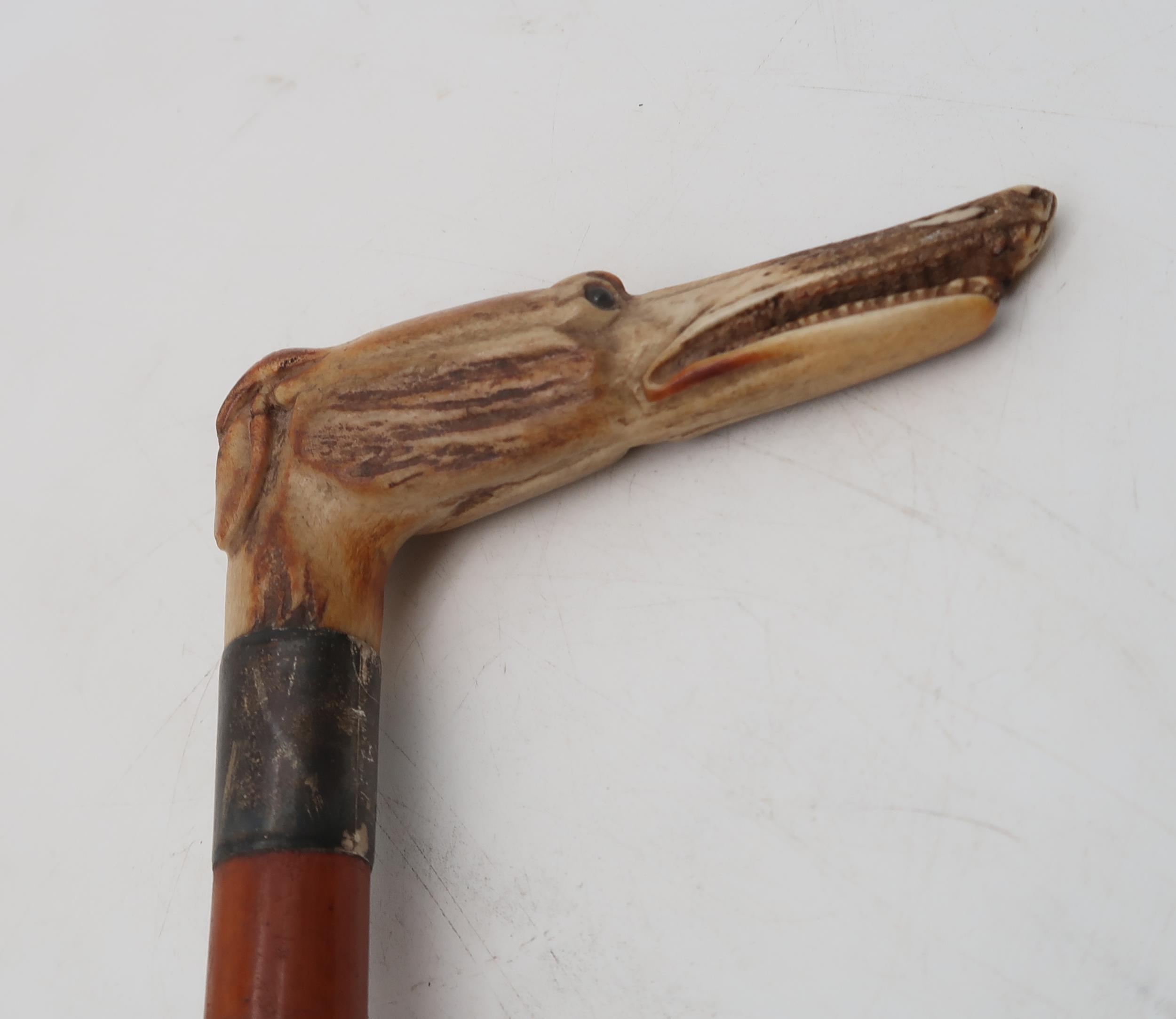 A silver collared riding crop, by H & S, London 1943, the handle carved in the form of a hound, - Image 3 of 4