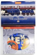 A boxed Hornby 00-gauge R2610 Limited Edition "The Caledonian Train Pack, together with an R2660M