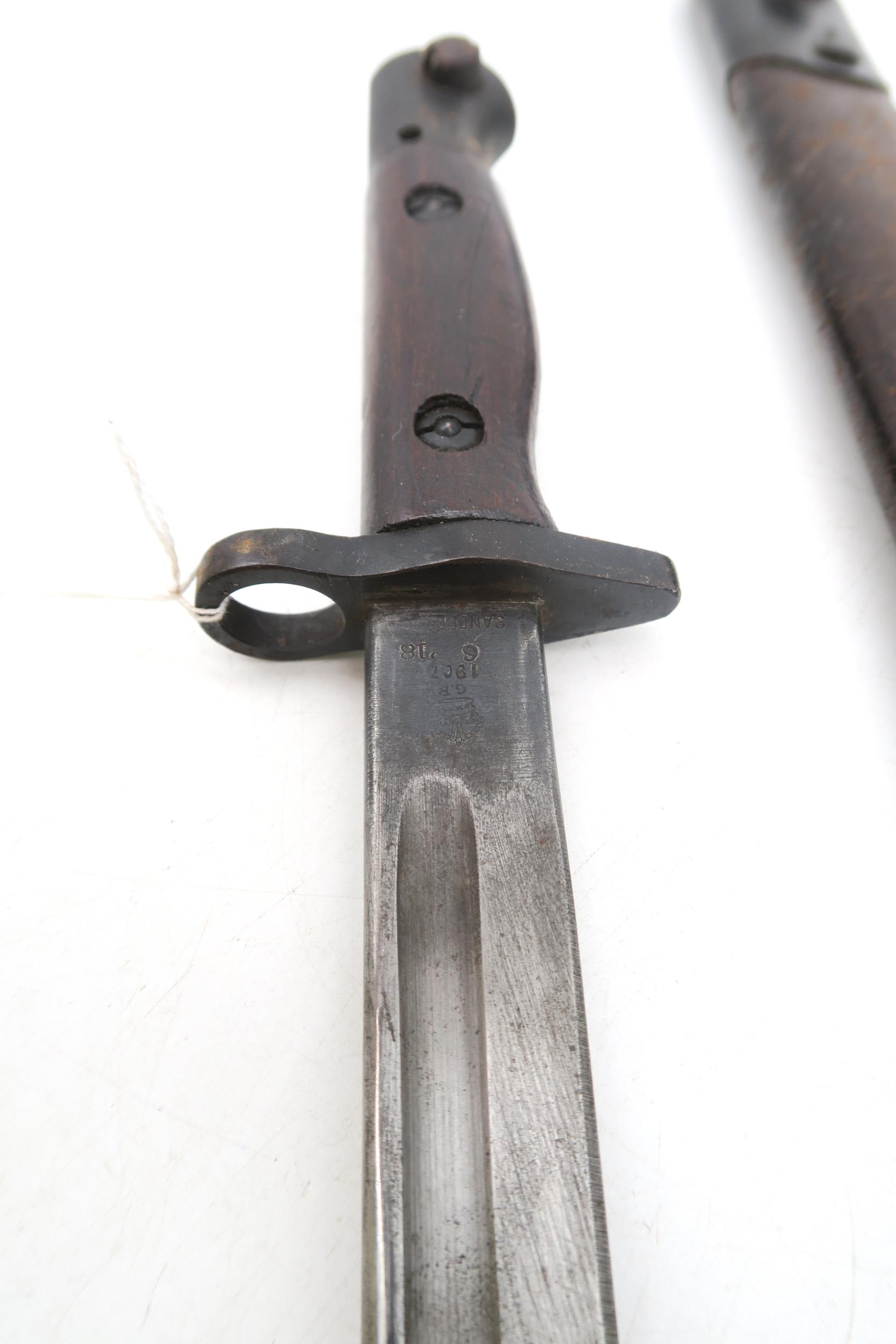 A WW1 British 1918-dated 1907 pattern bayonet by Sanderson, with scabbard; together with another, - Image 3 of 4