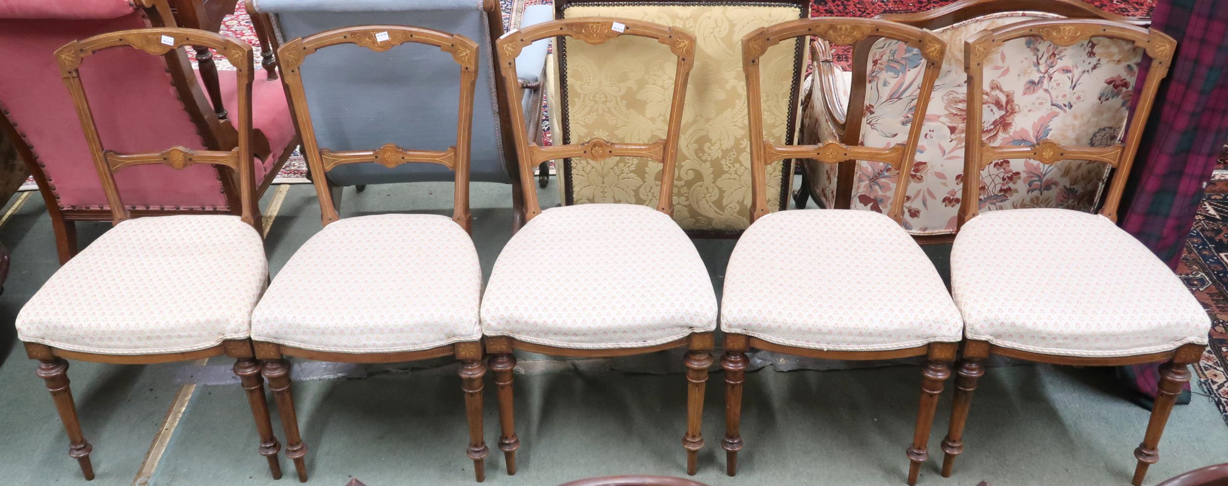 A set of five Victorian walnut framed dining chairs on turned front supports, 87cm high (5)