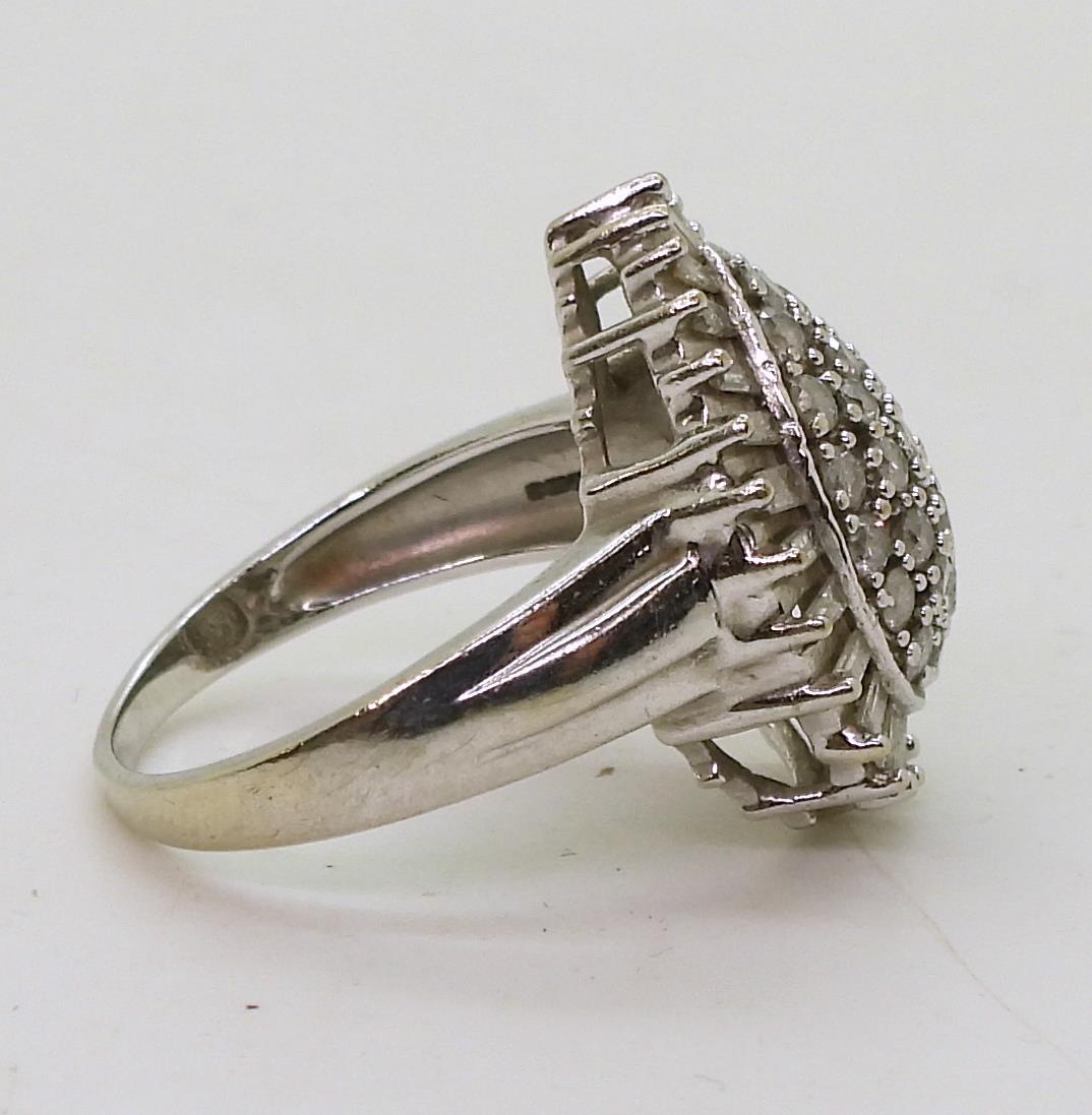 A 9ct white gold diamond cluster ring, set with estimated approx 1ct of brilliant and baguette cut - Image 4 of 5