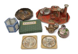 A collection of oriental ceramics including a pair of Satsuma dishes, signed Yasuda company, a