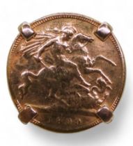 An 1899 gold half sovereign in a yellow metal ring mount, size R, weight 6.7gms Condition Report: