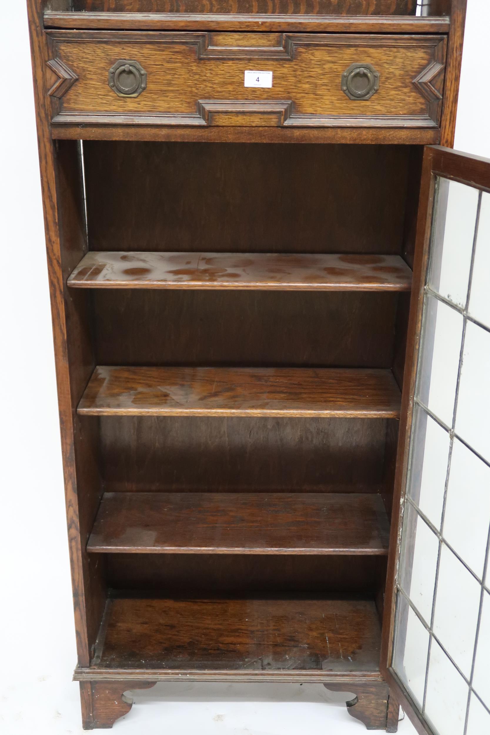 An early 20th century oak Jacobean style bookcase with single drawer over leaded glass door on - Image 3 of 3