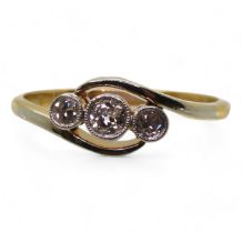An 18ct gold and platinum vintage three stone diamond ring, set with estimated approx 0.20cts of old