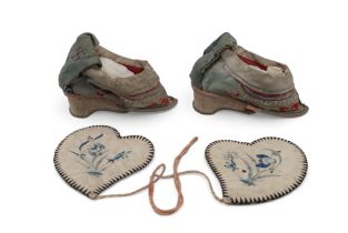 A pair of Chinese silk pale blue ground lotus shoes, and a pair of silk embroidered ear muffs (2)
