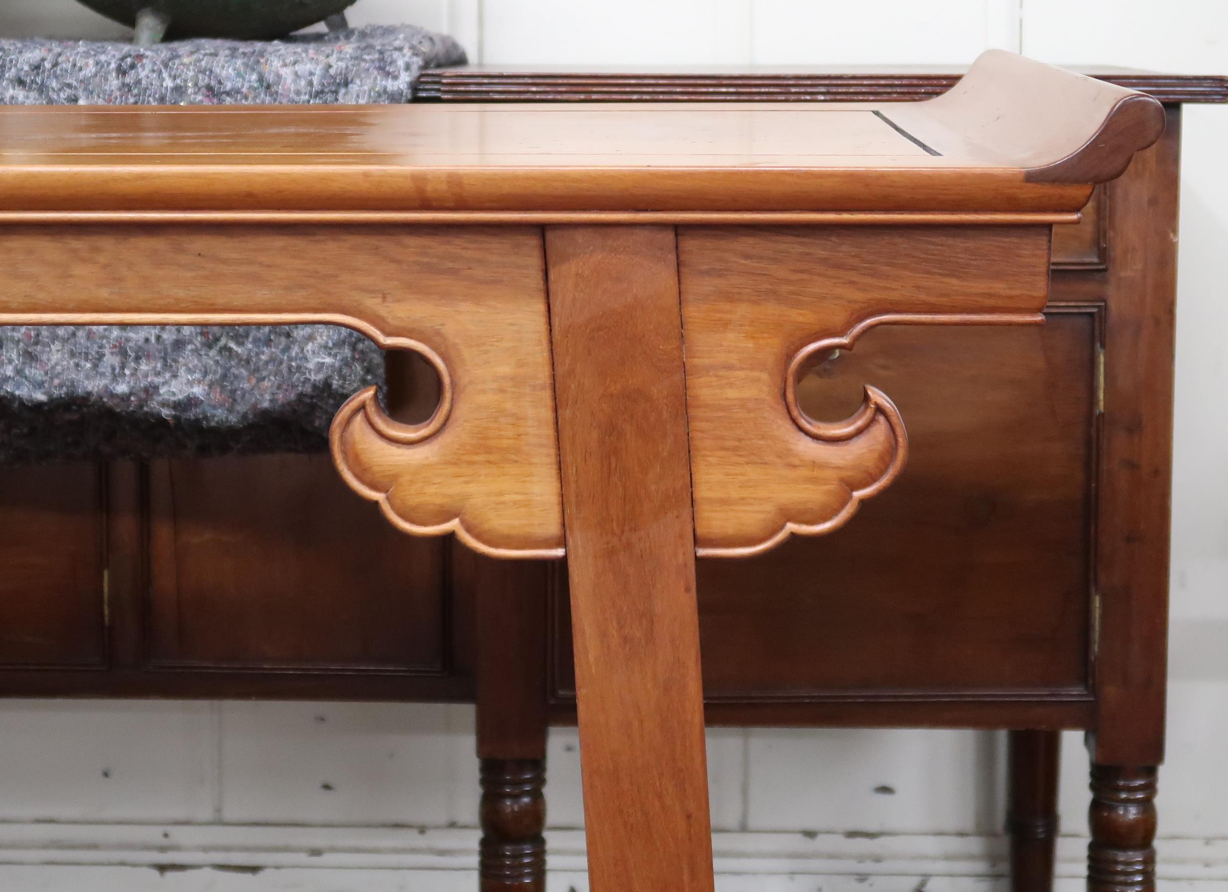 A contemporary Oriental hardwood altar table with upswept rectangular top with shaped friezes on - Image 2 of 3