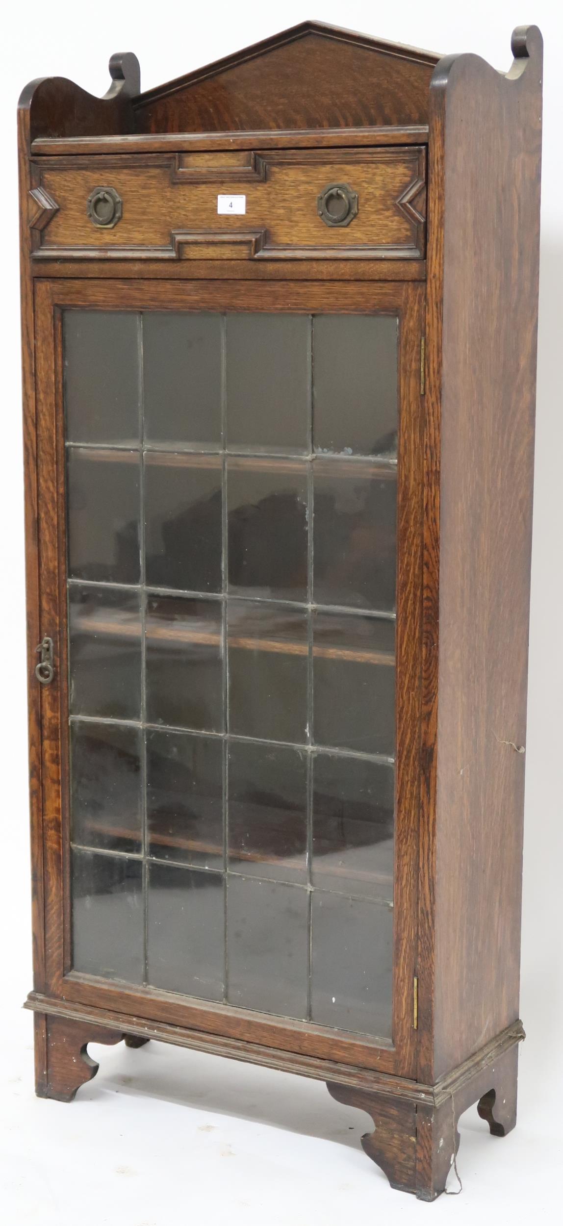 An early 20th century oak Jacobean style bookcase with single drawer over leaded glass door on - Image 2 of 3