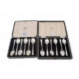 A set of cased silver teaspoons, by James Deakin & Sons, Sheffield, and another by Elkinton & Co,