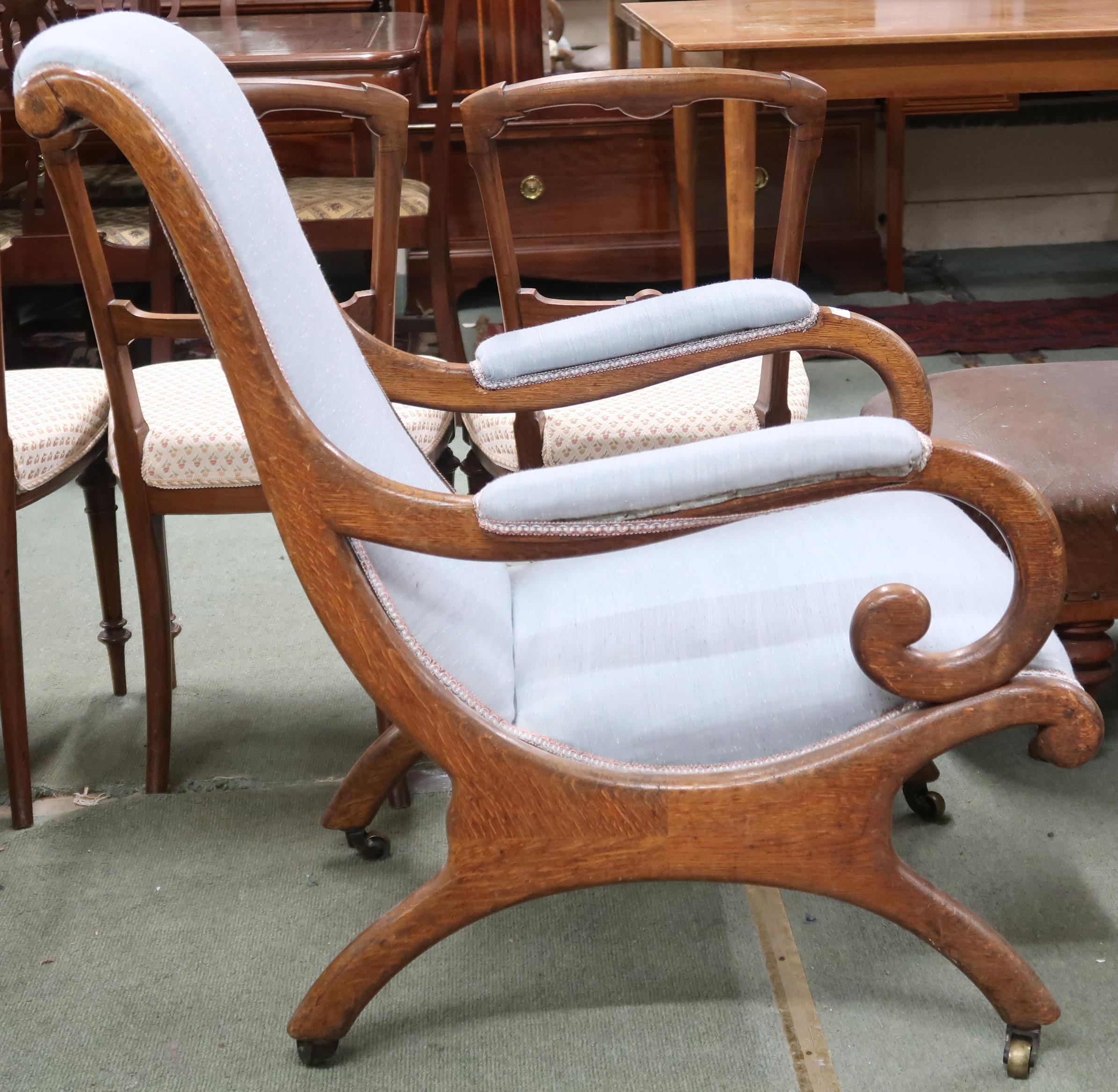 A Victorian oak framed scroll armed slipper chair on bowed supports, 95cm high x 69cm wide x 88cm - Image 2 of 2