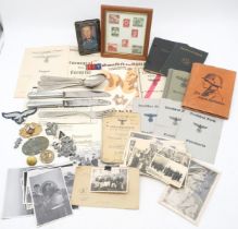 A collection of items relating to the German Third Reich, comprising a Waffen-SS Panzer dog tag;