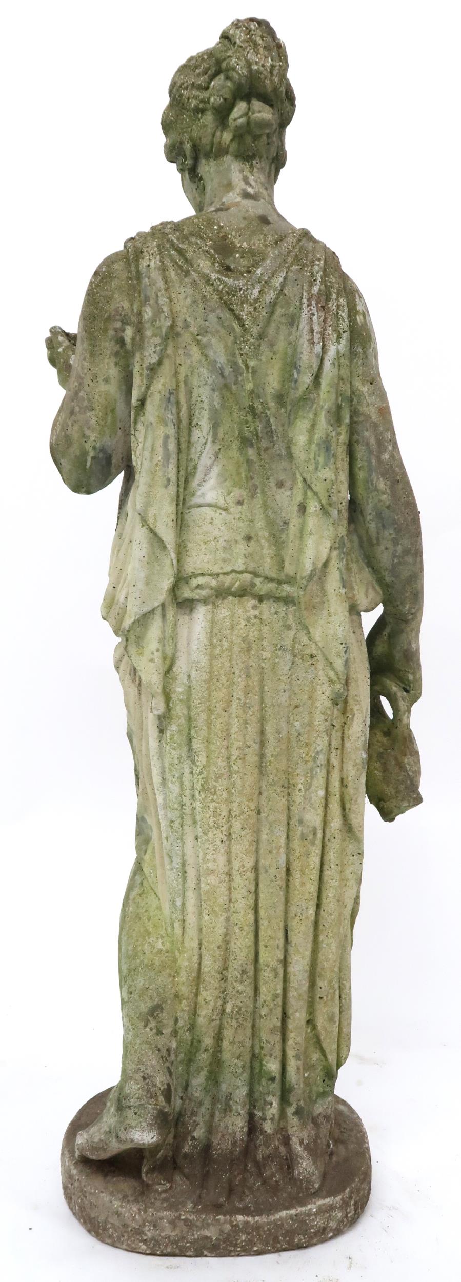 A 20th century reconstituted stone garden statue of a classical lady in toga carrying jug and - Image 3 of 3