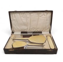 An Art Deco cased silver yellow guilloche enamel dressing set, by Adie Brothers Ltd, Birmingham