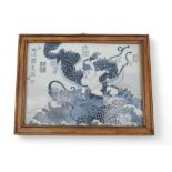 A blue and white porcelain plaque, depicting Nezha battling the East Sea Dragon, a celadon ground