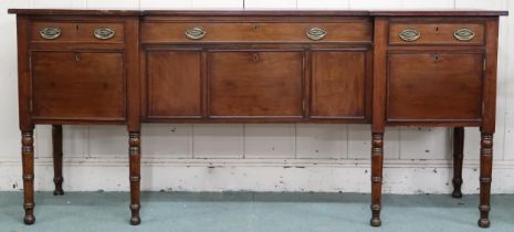 A late Victorian mahogany inverted breakfront sideboard with three drawers over three cabinet