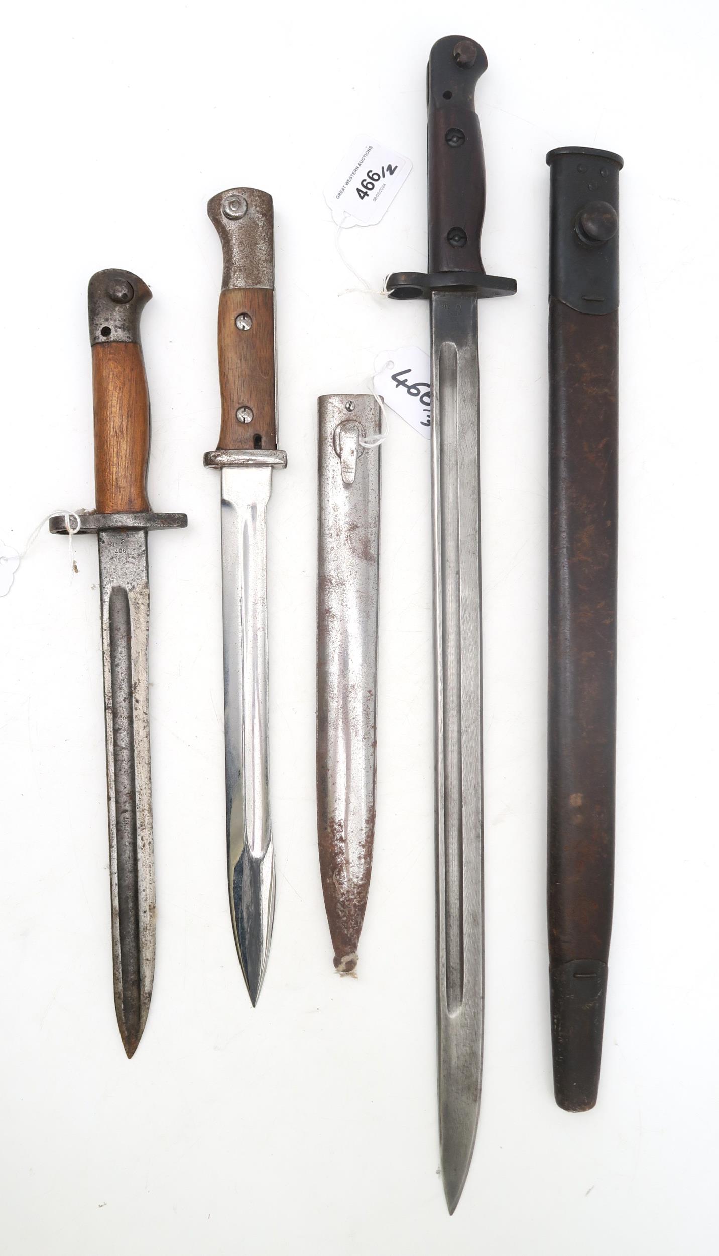 A WW1 British 1918-dated 1907 pattern bayonet by Sanderson, with scabbard; together with another,