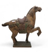 A Chinese carved wooden polychrome horse, in the Tang Style Condition Report:Available upon request