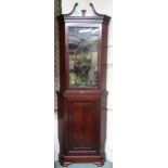 An early 20th century mahogany astragal glazed corner cabinet with scrolled surmount over astragal