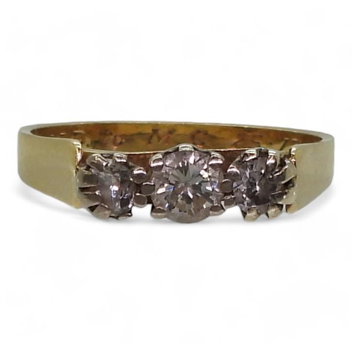 An 18ct gold three stone diamond ring set with estimated approx 0.50cts of brilliant cut diamonds,