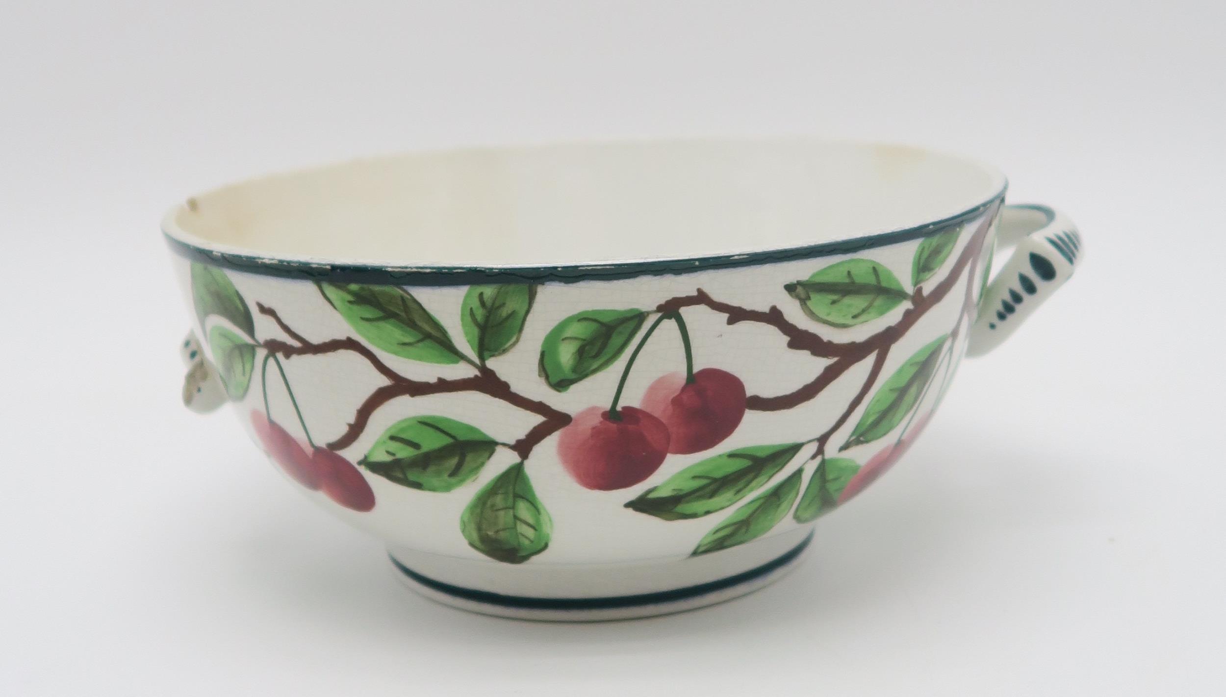 A collection of Wemyss ware cherry painted pottery including a two handled bowl, a chocolate cup and - Image 2 of 6