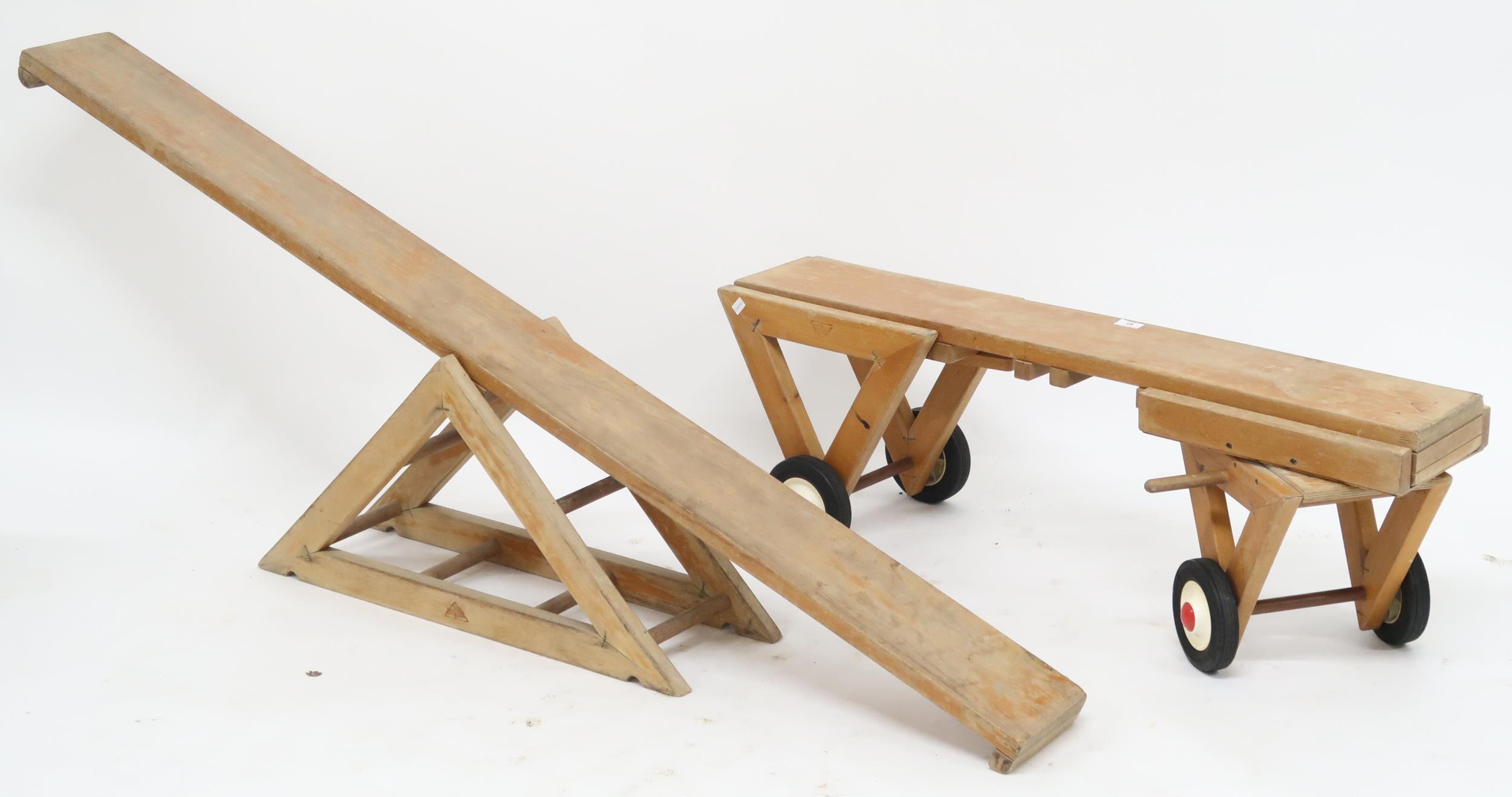 A lot comprising mid 20th century "Good Wood" child's see-saw and wheeled carriage (2) Condition